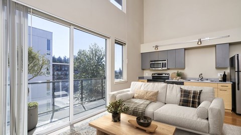 A modern living room with a grey couch and a wooden coffee table.